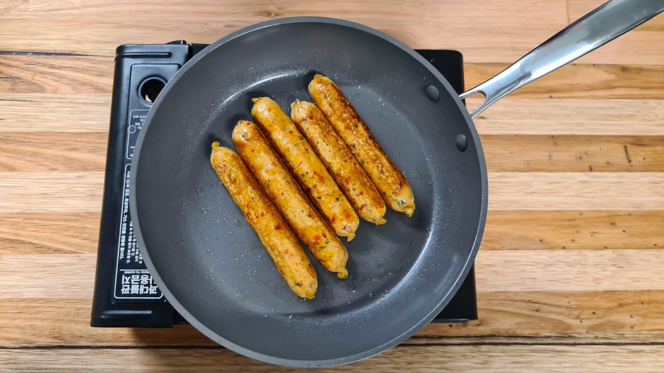 lentil sausage cooked in a pan